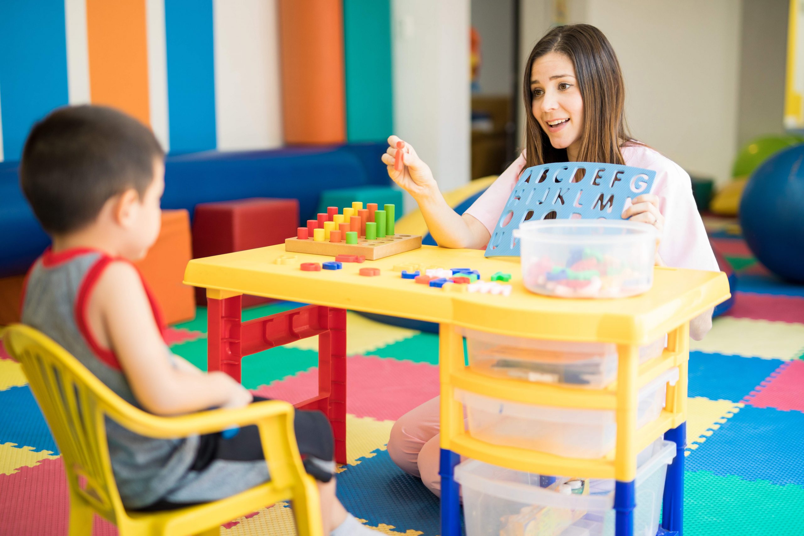 special education teacher strategies used with a patient in a classroom